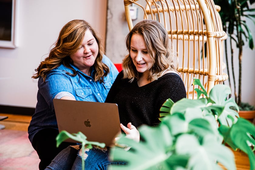 Two women looking at a computer