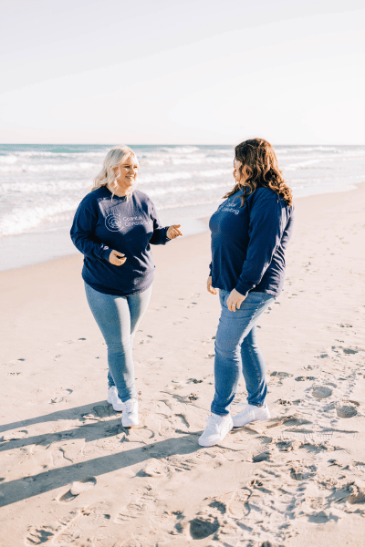 Lauren and Maura Talking on the Beach