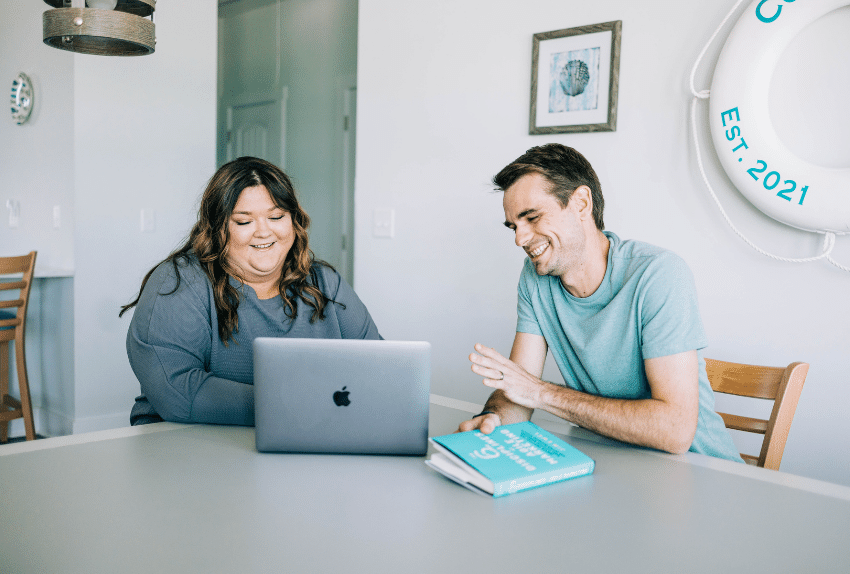 Coworkers at a Table with a Laptop